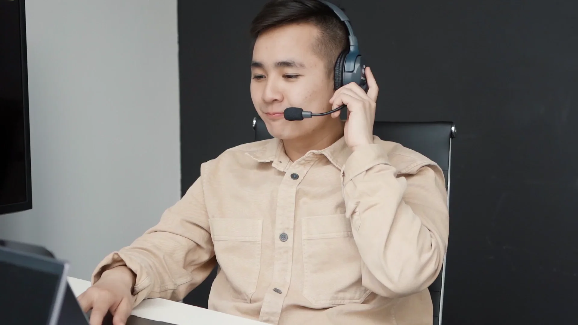 Professional candidate wearing a headset during a structured interview session